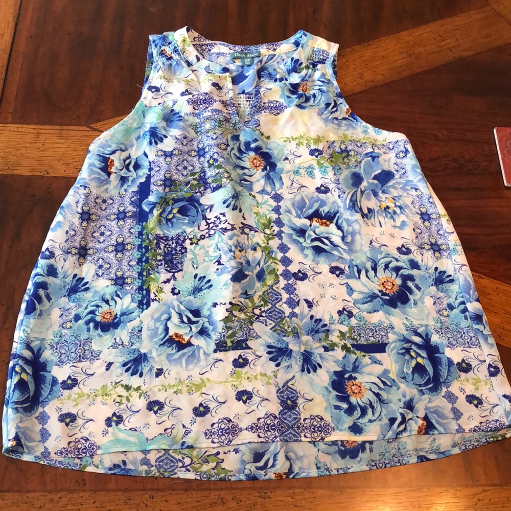 Floral sleeveless dressy blouse.